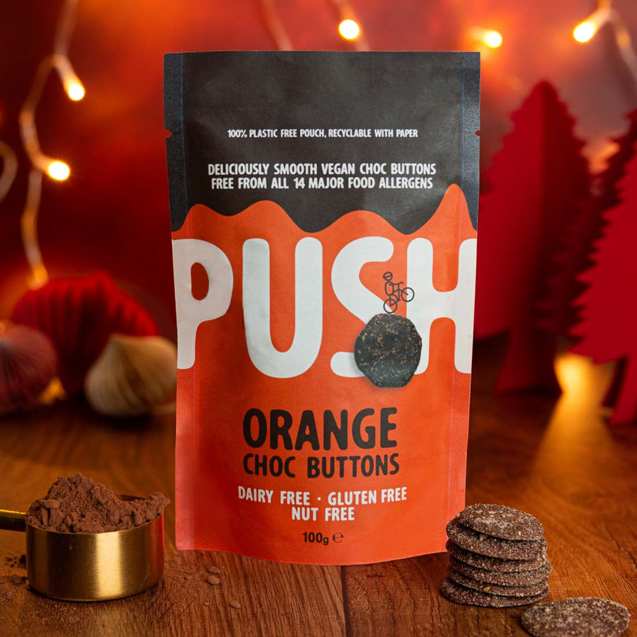 Vegan Orange Chocolate Buttons on a Christmas backdrop